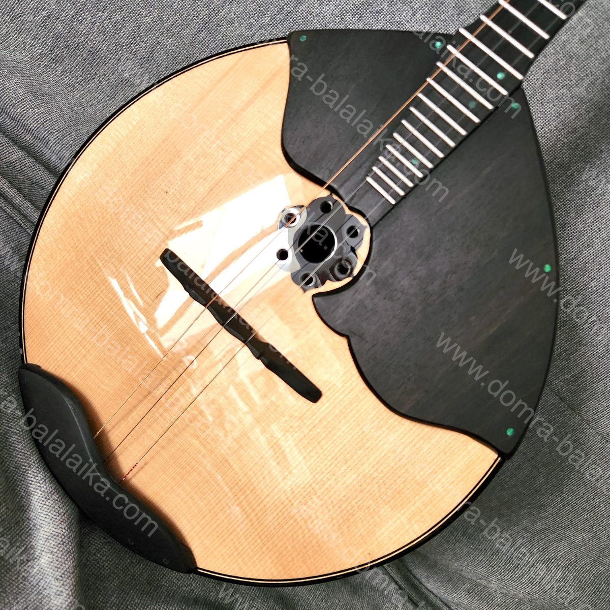 A student Russian Pro domra with an ebony neck and fingerboard, and a body in a..., photo 5