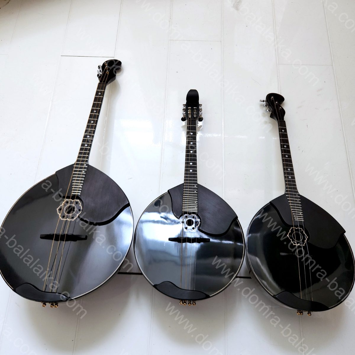 From left to right in the photo: a black top-grade concert alto domra, a black..., photo 10