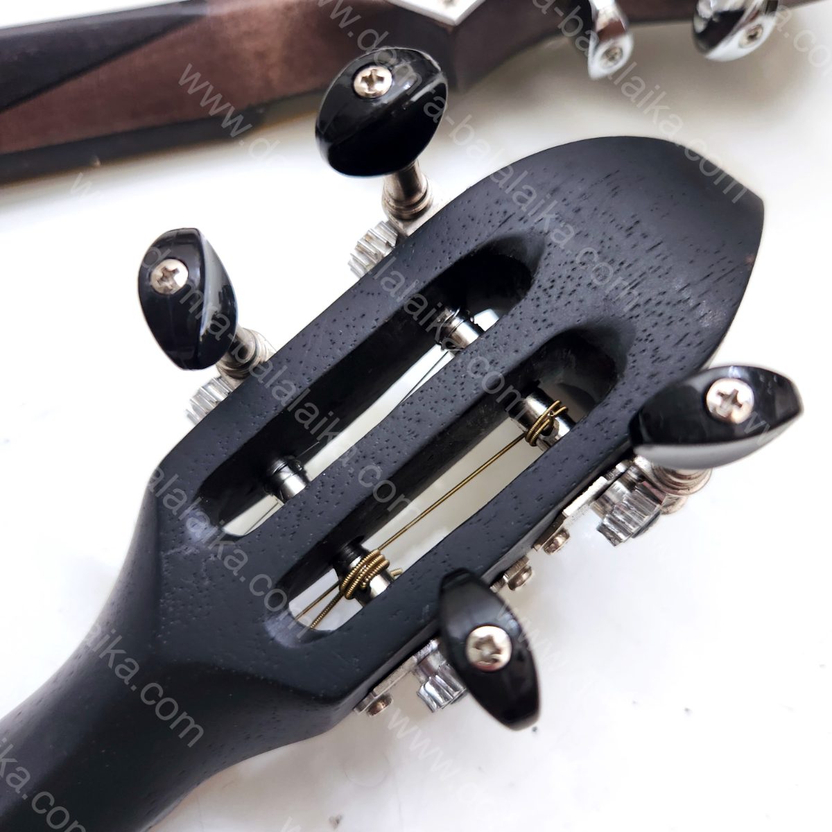 From left to right in the photo: a black top-grade concert alto domra, a black..., photo 3