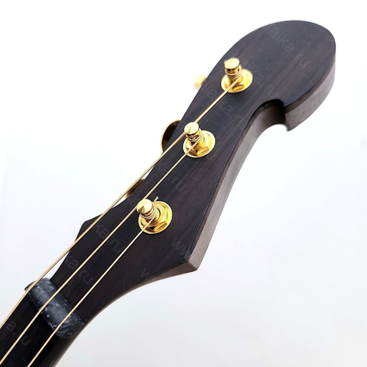 The photo shows an electric alto domra in a “natural” violin‑brown colour. In r..., photo 2