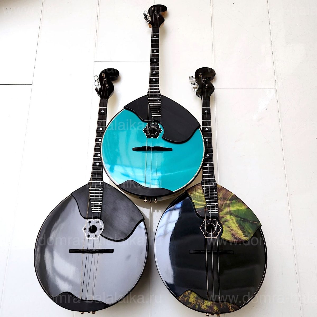 The photo shows three luxury concert‑grade domras of the highest category: “Bla..., photo 3