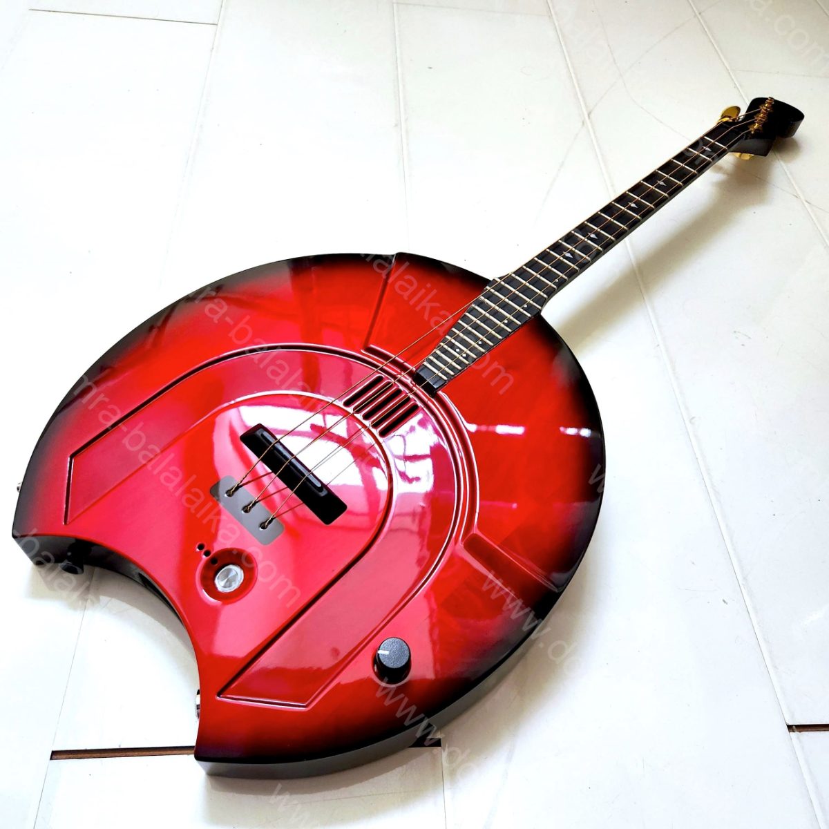 We have completed an electric alto domra in red with a black burst finish along..., photo 1