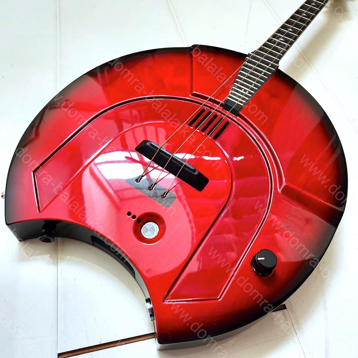 We have completed an electric alto domra in red with a black burst finish along..., photo 2
